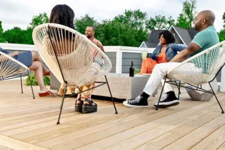 happy friends enjoying outdoor deck